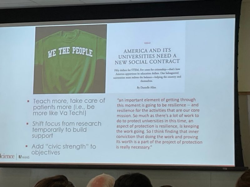 Holden Thorp lecture slide c This photo shows a lecture slide with an image of a green t-shirt and the words We the People emblazoned on the front.