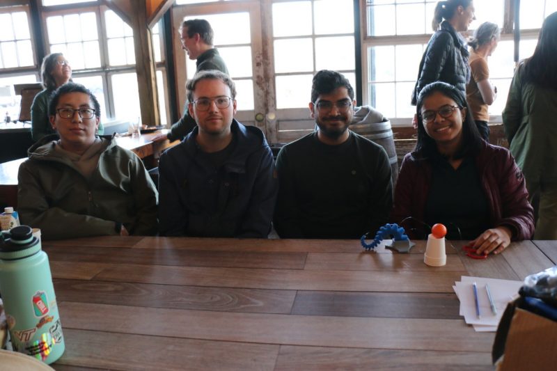 Naughton's Lab sits behind a tentacle prototype, ball, and cup