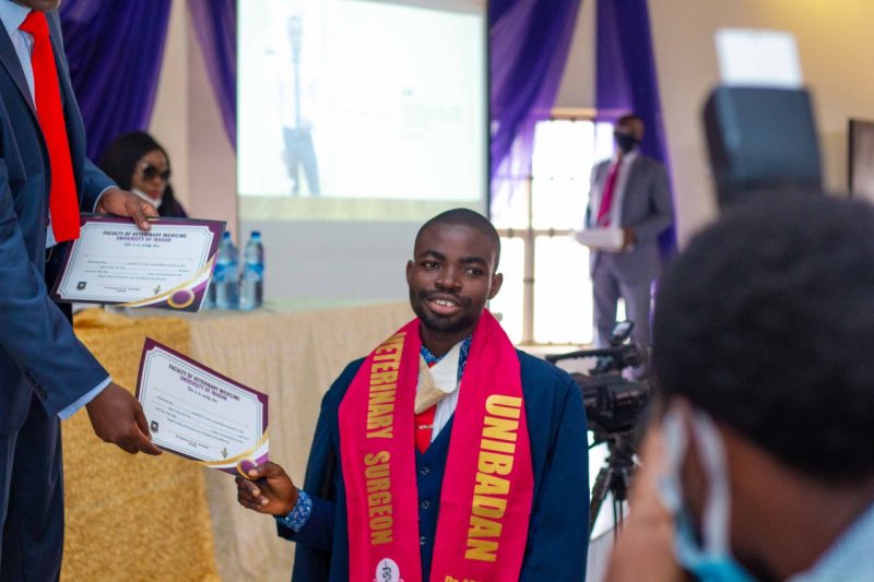 Abraham Adeyemo 2 Abraham Adeyemo smiles as he receives his diploma during his vet school commencement.