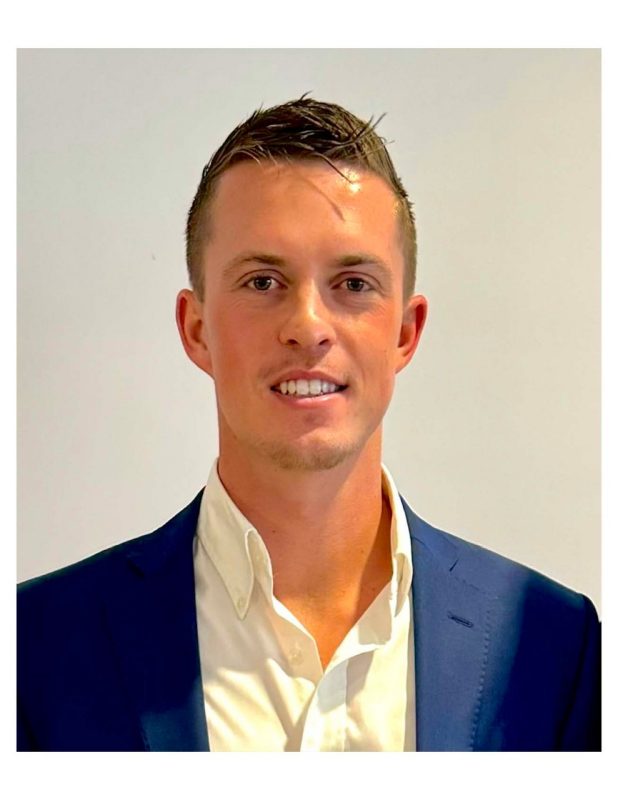 Jordan Boone Headshot A headshot of a caucasian male with a dark blue blazer and white dress shirt.
